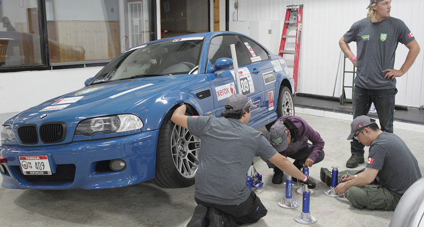 picture of the Hume Media Targa Newfoundland 2018 team working on a car